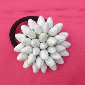 Artificial jasmine buds white floral hair tie with elastic band on pink background