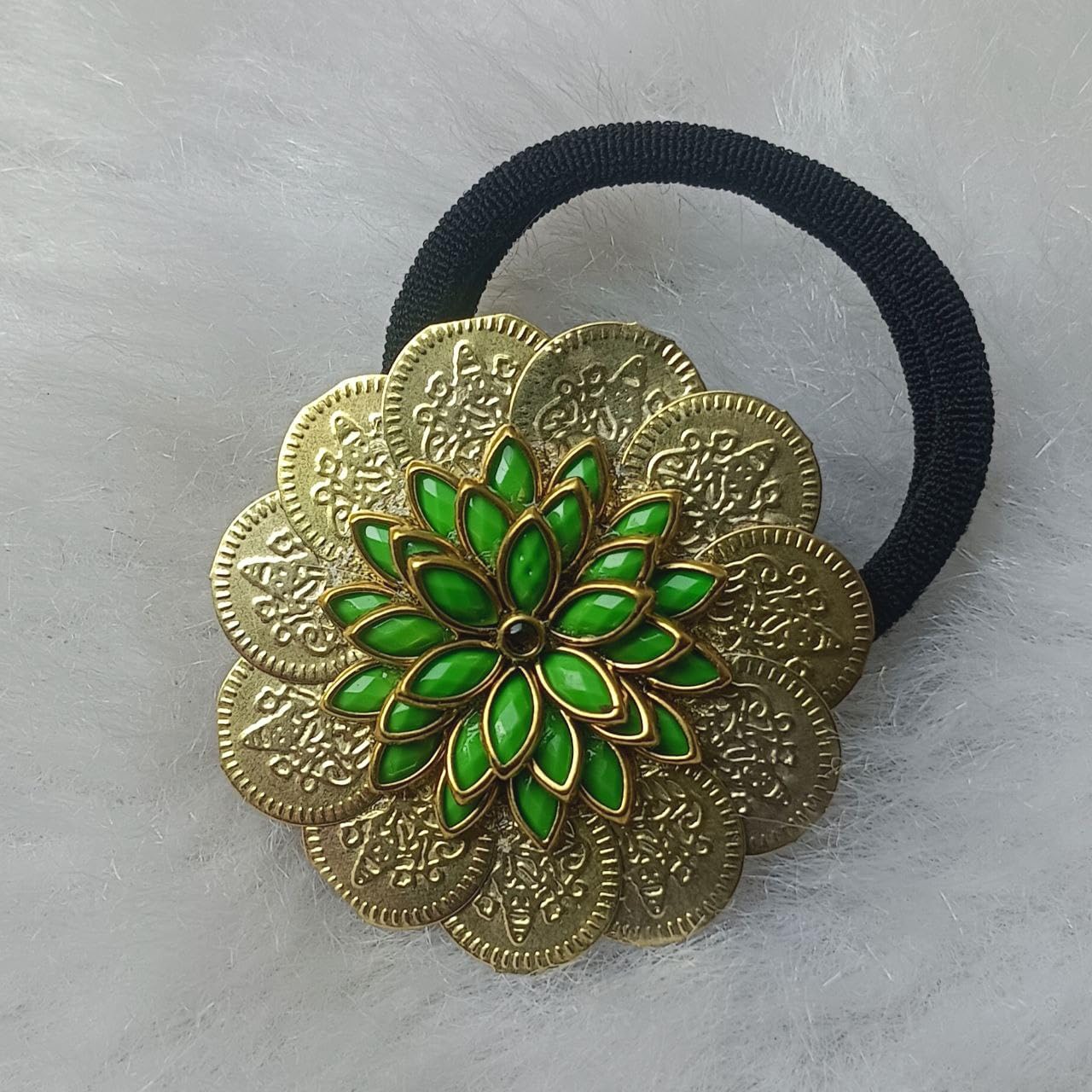 Floral Gold-Tone Hair Band with Green Enamel Design Gold-tone floral hair band with green enamel petals and black elastic on a soft background
