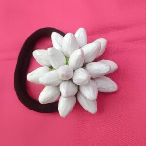 Artificial jasmine buds white floral hair tie with elastic band on pink background