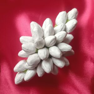 Artificial jasmine buds white floral hair clip barrette on pink background