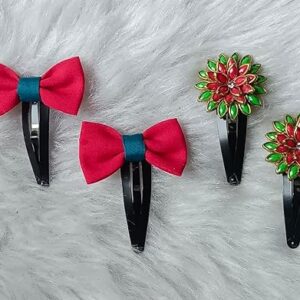 Red cloth bow hair clips and red-green floral stone snap clips displayed on a soft fur background.