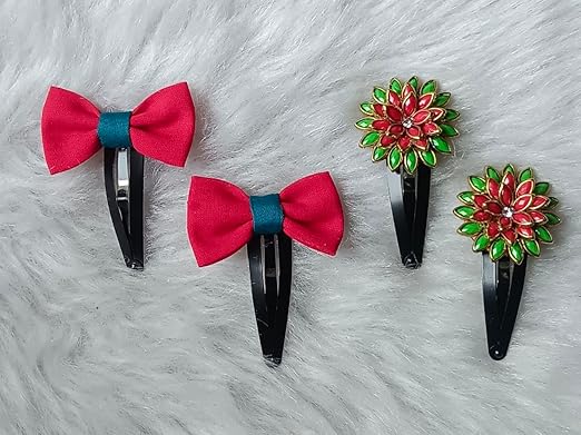 Red Cloth Bow & Red-Green Floral Stone Snap Hair Clip Set – Pack of 2 Red cloth bow hair clips and red-green floral stone snap clips displayed on a soft fur background.