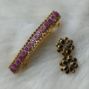 Purple kundan saree pin and matching floral hair clip in gold tone with square stones on a soft white background