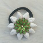 Green kundan floral hair tie with white petals