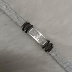 Stylish silver mesh bracelet with metallic centerpiece and black accents for men